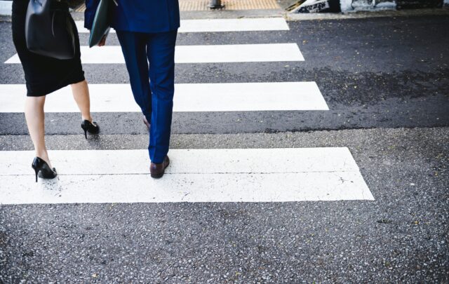 pedestrian crossing the street