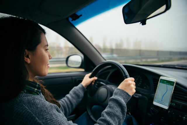 woman driving on the road