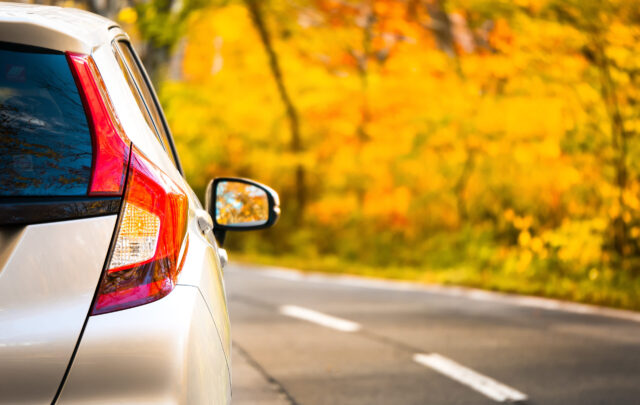 car autumn driving on road